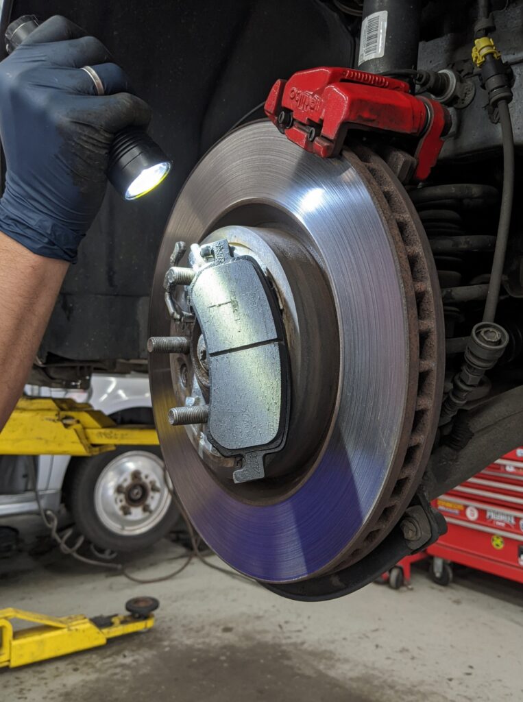 : brake maintenance inspection on modern vehicle